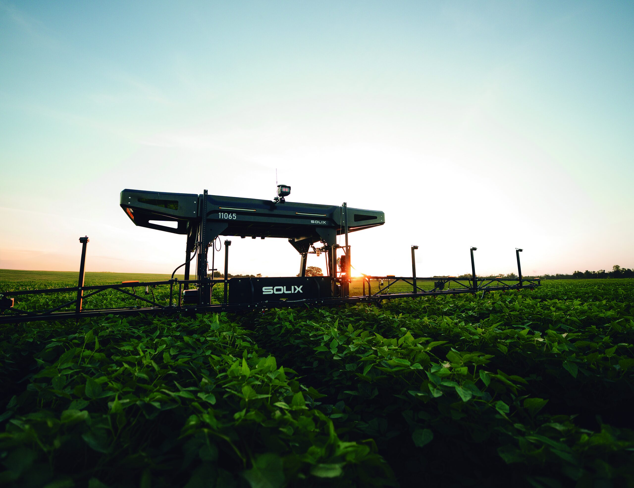 Solix autonomous solar-powered robot in a green crop field
